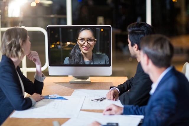 Business team having video conference in the conference room.jpeg